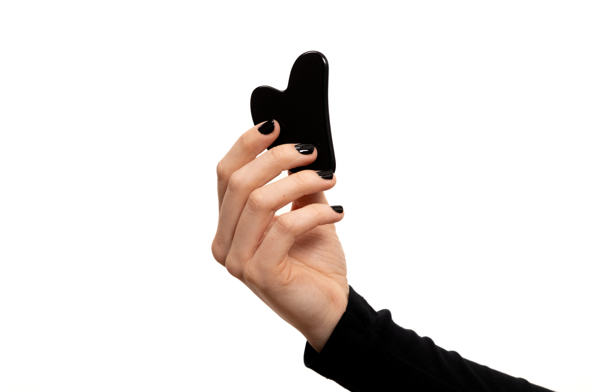 Natural black obsidian gua sha for lymphatic drainage, facial contouring, and relaxation