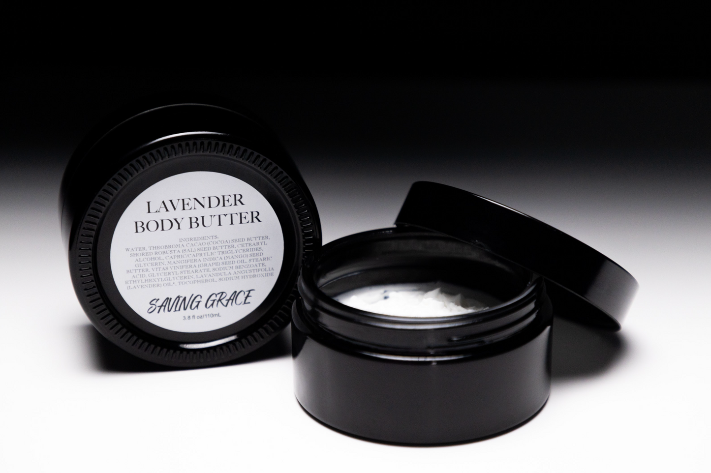 Saving Grace Lavender Body Butter in UV black glass jar, whipped hydrating cream with cocoa, sal, and mango butters for soft, nourished skin