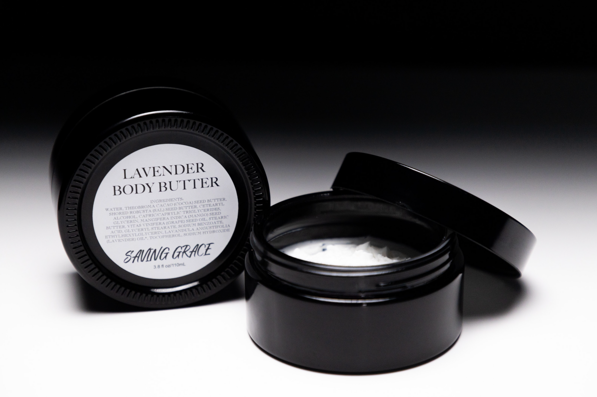 Saving Grace Lavender Body Butter in UV black glass jar, whipped hydrating cream with cocoa, sal, and mango butters for soft, nourished skin