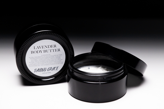 Saving Grace Lavender Body Butter in UV black glass jar, whipped hydrating cream with cocoa, sal, and mango butters for soft, nourished skin