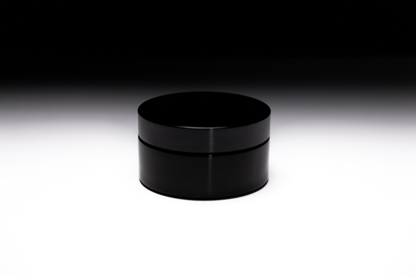 Whipped lavender body butter in black glass jar, hydrating and nourishing skincare cream, free from parabens, sulfates, and phthalates