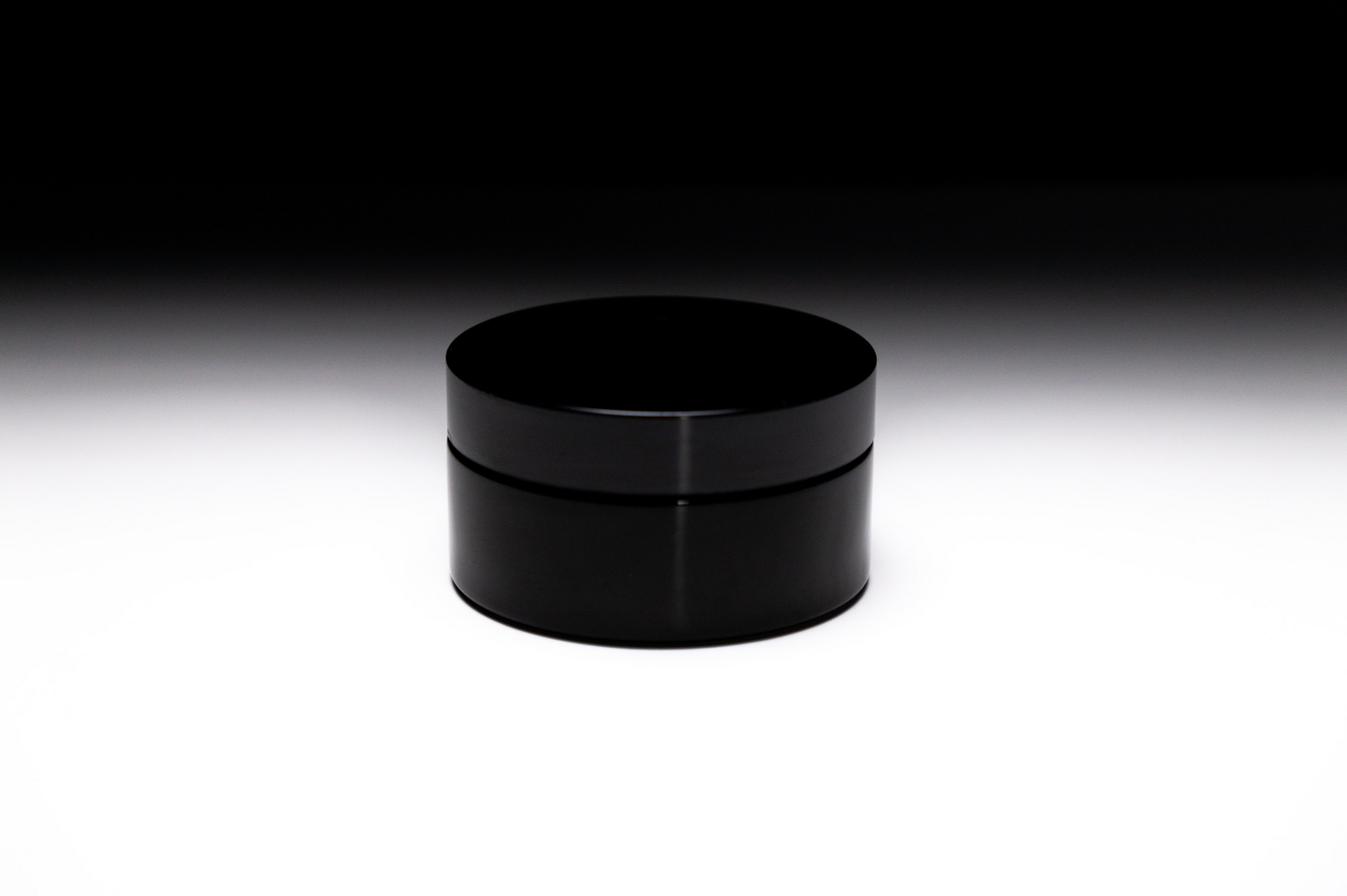 Whipped lavender body butter in black glass jar, hydrating and nourishing skincare cream, free from parabens, sulfates, and phthalates